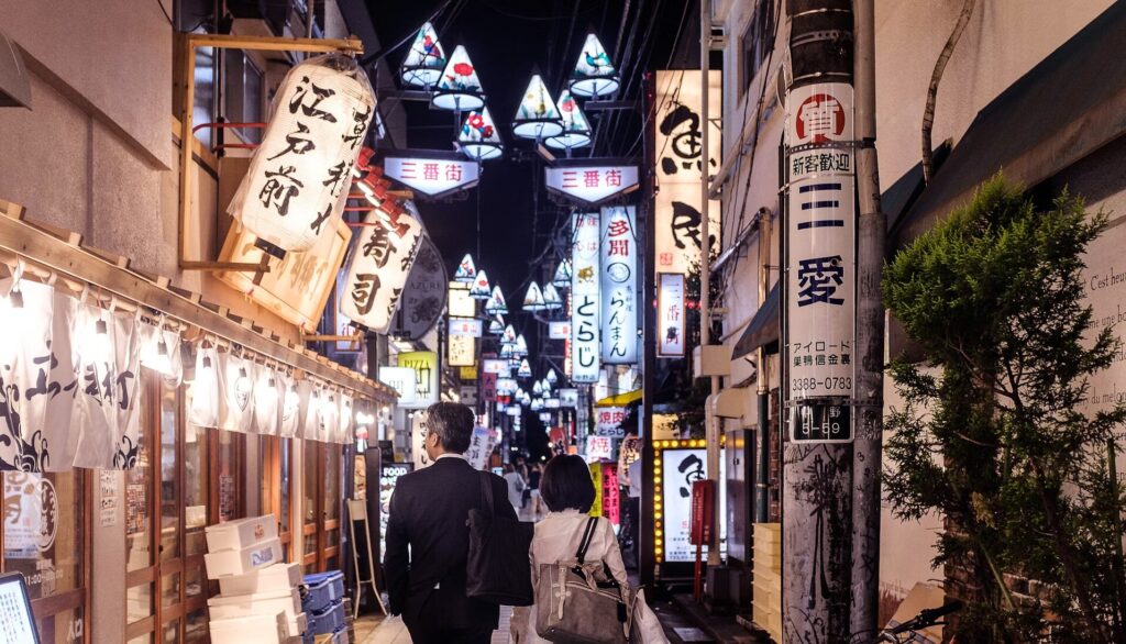 A couple walking through one of Tokyo’s bustling streets