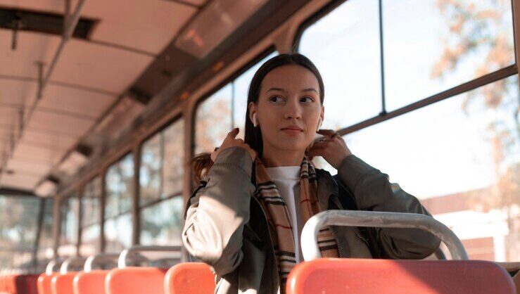 A woman taking public transportation when travelling