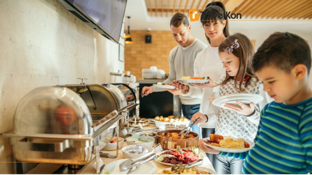 a group of people standing in a buffet at family hotels in tokyo japan