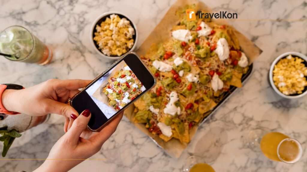 a person taking a picture of food