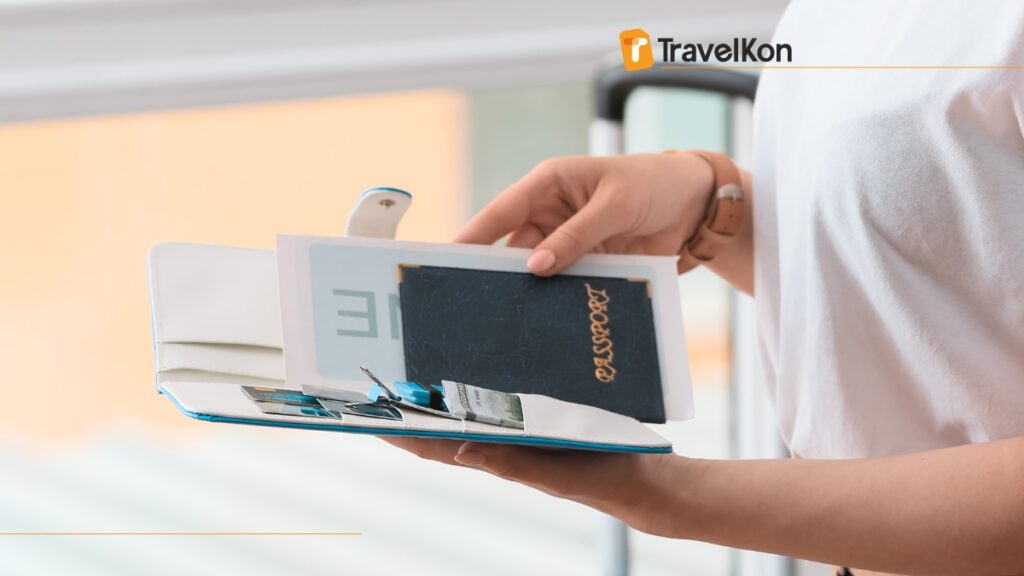 a person holding a passport and a book