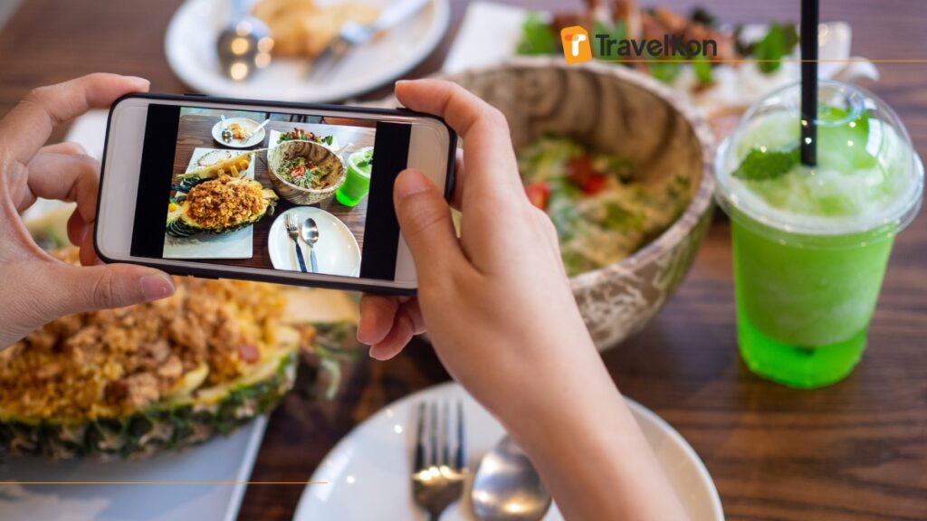 a person taking a picture of food
